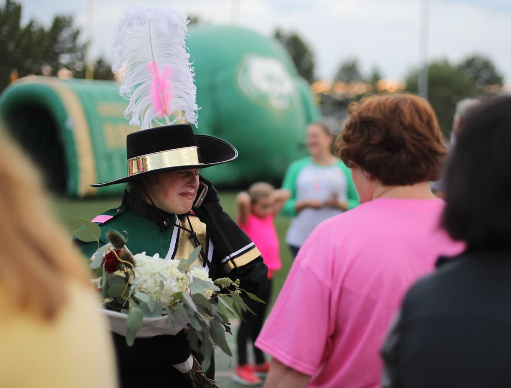 Rock Bridge senior Emma Pierce cries while on the phone with her father